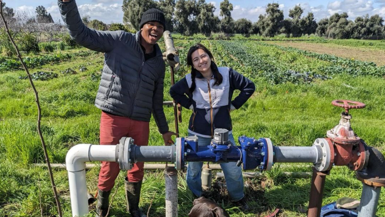 Market Garden Student Farmers installing a new water meter.