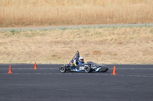 A photo of GreenSpeed's electronic racecar driving