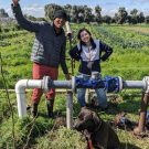 Market Garden Student Farmers installing a new water meter.